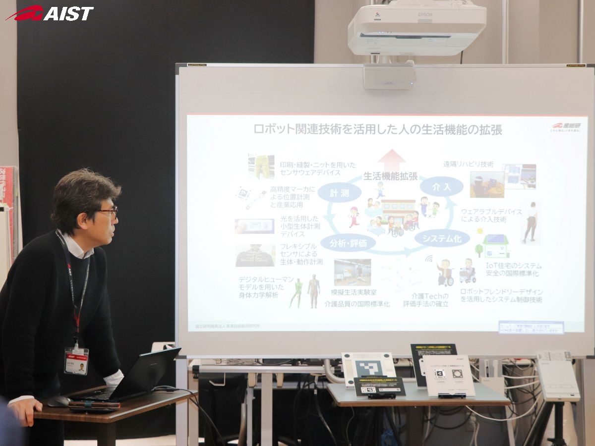 研究紹介をする田中さん